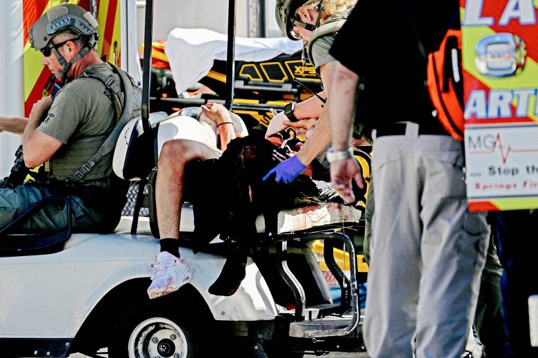Medical personnel tend to a victim following a shooting at Marjory Stoneman Douglas High School in Parkland, Florida, on Wednesday.